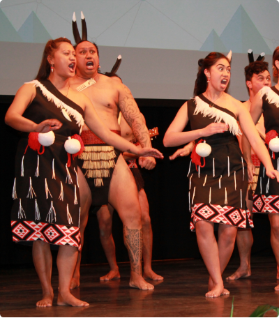 Our wahine and tane performing on stage for Haka Powhiri for NZSE Graduation