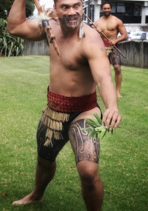 HAKA WORKSHOPS: Māori warrior with taiaha on marae showing off his skills